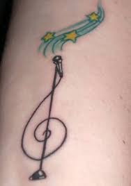 Pin By Dora M On Body Art Piercings Music Tattoo Designs Microphone Tattoo Tattoo Designs For Girls