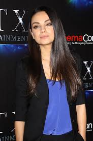 The hair has been parted to the side. Mila Kunis S Test Drives The Summer Bob Vogue