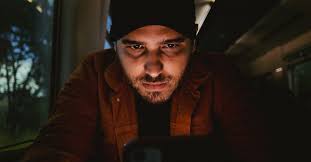 Man Using Cellphone in Dark Train · Free Stock Photo