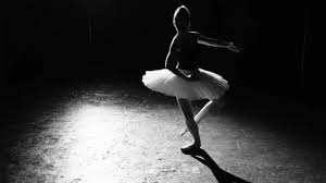 Felicity, the naughty, flexible ballerina likes to tease you with her flexibility poses. Professional Flexible Ballerina Dancing On Her Pointe Ballet Shoes In Spotlight On Black Background In Studio Woman Shows Classic Ballet Pas Wearing Tutu And Pointe Shoes Black And White Shot Video