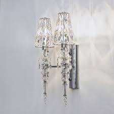 It has a cylindrical clear glass shade with gentle vertical lines, which diffuse and refract the light from one 60w bulb (not included). Chandeliers Wall Mounted Chandeliers High Quality Designer Chandeliers Architonic