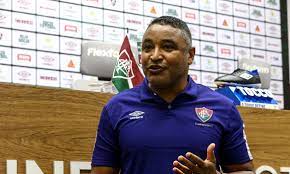 Está preparando o terreno para a demissão do roger, para que o próximo treinador ganhe o boost celestial legado do roger machado e elimine o flamengo nas semis da libertadores. Fluminense Apresenta Roger Machado Como Tecnico