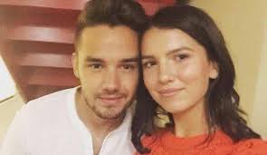 Liam Payne keeps a low profile as he lands in the UK after it's revealed  he's dating US beauty