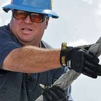 Fred Beck, an able body seaman aboard the Military Sealift Command hospital  ship USNS Mercy (T-AH 19), handles mooring line.