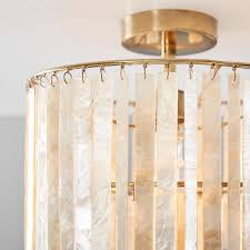 Reflect your boho style with this flush chandelier featuring handcrafted wooden beads. Capiz Strip Flush Mount Lighting Pottery Barn Teen