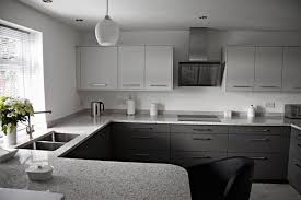 If you already have a lot of gray and white in your kitchen, a great option to paint your cabinets could be a dark navy blue. Grey Kitchen White Worktop Google Search White Granite Countertops Replacing Kitchen Countertops White Granite