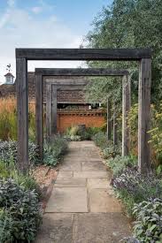 30 Simple And Eye Catching Cheap Walkway Ideas To Beautify Your House Homelovers Modern Garden Design Walkway Design Walkway Landscaping