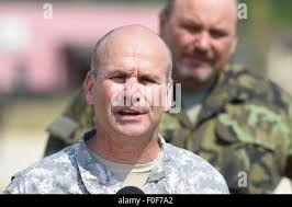 The Commander of The Joint Multinational Readiness Center Operations Group,  Col. Anthony T. Murtha, and the Hohenfels Deputy Garrison Manager, Mr. Patrick  Rothbauer, celebrate the beginning of a new school year on