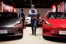 Tesla deliveries to hit record, but fall short of Musk's aspirations |  Reuters