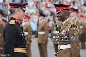 Major General Tim Radford DSO OBE speaks with one of the soldiers... News  Photo