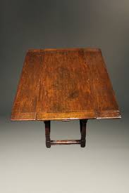 Cerused wood coffee table from era interiors. English Jacobean Style Side Draw Leaf Table