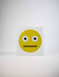 A yellow face with simple, open eyes and a flat, closed mouth. Straight Face Emoji Decal Wallflower Market