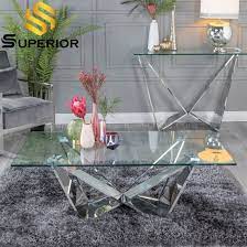 The coffee table is the piece of resistance in the living room. China Luxury Modern Transparent Glass Coffee Table With Stainless Steel Base China Home Furniture Set Chinese Tea Table