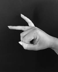 Let's talk about finger tattoo designs. White Ink Love Tattoo On The Right Ring Finger