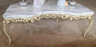 52 w x 32.5 d x 19 h. French Provincial Marble Top Coffee Table Kraft Auction Service