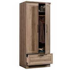 The armoire is constructed of sturdy and durable compressed wood. Sauder Homeplus Wardrobe Armoire In Salt Oak 423007