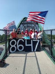 A Secret Service investigation is underway after Judd and Wendy Hoff protested on Interstate 94 bridge with a sign reading “86-47,” seen by some as a threat to President Trump.