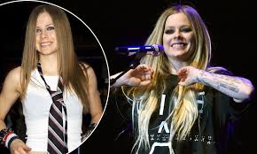 Her single alice was featured in tim burton's movie alice in wonderland. Avril Lavigne Hasn T Aged A Day During Her 18 Years In The Spotlight As She Attends Music Festival Daily Mail Online