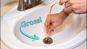 Dip the clean washcloth into the paste, then scrub the drain stopper until it is clean. How To Clean A Clogged Sink Remove Stopper Youtube