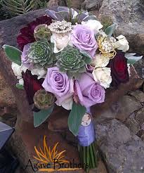 Diy bridal bouquet with succulents (succulent bouquet)#gifted bridal bouquets can be an expensive part of a wedding budget. Light Purple Deep Red Roses Succulents And Brooches Love Www Agavebrothers Com Flowers Brooch Bouquet Succulent Color Wed Red Roses Succulents Agave