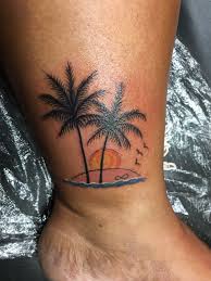 The next palm tree tattoo idea you will love if you want something unique. Palm Tree Tattoo With A Beautiful Sunset On A Beach Infinity In The Sand Sunset Tattoos Palm Tree Tattoo Palm Tattoos