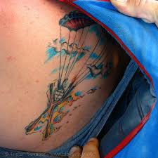 Touch device users, explore by touch or with swipe gestures. Skydiver Tattoo Burning Man 2006