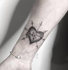 The open heart tattoos come in one of two distinct shapes. Sacred Heart Tattoos Tattoo Me Now