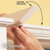 Make sure you secure the woodblock to the cabinet first and then nail the crown molding to that. 1