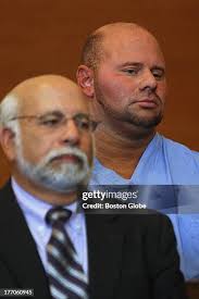 Attorney Peter Bella, left, stood by as his client Jared Remy, who... News  Photo