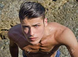 Handsome Young Man Looking Up Outdoors, Shirtless Stock Photo, Picture And  Royalty Free Image. Image 21053898.