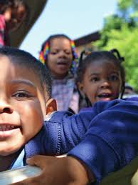 Endearing faces of children such as Shawn Sanders, 3, foreground; Arnayah  Bryant, 3, rear right; and Eliana Horne, 3, rear, help