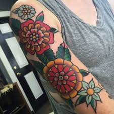 Several colors appear in this tattoo like sea green, pink, yellow, red, green, and more. Beautiful Traditional Flowers Sleeve Tattoo Tattoogrid Net