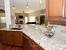 Dark Maple Cabinets With White Countertops