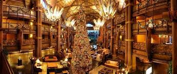 A Huge Christmas Tree In The Animal Kingdom Lodge In Walt Disney World Disney World Christmas Animal Kingdom Lodge Disney World Travel Agent