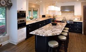 Make your kitchen look elegant with black laminated cabinets on the top and bottom. 30 Kitchens With Stylish Two Tone Cabinets