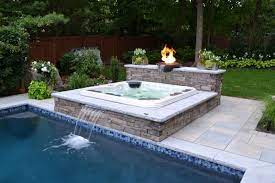 So i came up with the idea to add a jacuzzi to the pool. Are You Thinking Of Adding A Spa To Your Pool Hot Tub Backyard Inground Hot Tub Hot Tub Deck