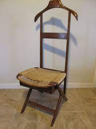 this valet chair in stained beech was once a staple of the 1950s and can be added to any modern collection as a unique statemen chair italian chair valet chair