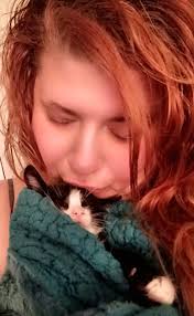 This is the homeless tuxedo I've been feeding he came today ate a little  bit and then crossed the street heading for the woods.