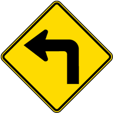 Black And Yellow Signage Left Turn Ahead Sign Road Signs Signs Traffic Signs