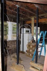 Jacking Up Sagging Floor Joists Bungalow Rehab 1910 Home Projects Basement Remodel Diy Cheap Basement Ideas
