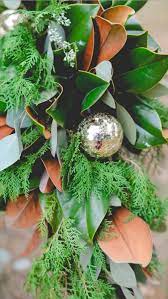 A Southern European Christmas Magnolias Leaves Seeded Eucalyptus Silver Dollar And Spruc Magnolia Christmas Decor Southern Christmas Holiday Season Christmas