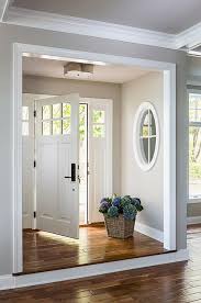 Step Up Leading To Foyer Nook Gray Walls With Interior Window And White Molding Casa Verde Design Interior Windows New Homes Home