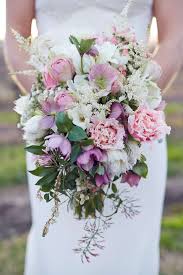 Wedding cake with sunflower and wildflower accents at barn wedding. Winter Barn Wedding Pink White Bride Bouquet The Wedding Playbook