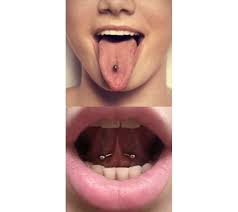 Double horizontal piercing, making two visible ends of a long jewelry on the tip of tongue look like snake eyes. The Guide To Tongue Piercings In Toronto Chronic Ink