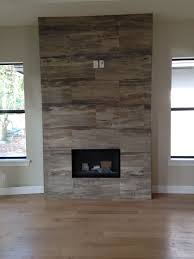 J Wood Tile Makes An Absolutely Stunning Fireplace Fireplace Fireplace Tile Surround Wood Fireplace Surrounds Reclaimed Wood Fireplace