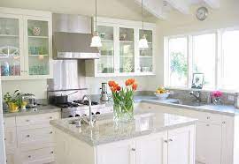 Everything looks grander, brighter and bigger with this mix of shades whether it's the white quartz countertops or the muted, cloudy blues on the cabinets, it's a luxurious experience in there. Luna Pearl Granite Countertop Kitchen Countertop Ideas White Cabinets Jpg 600 414 White Modern Kitchen Modern Kitchen White Kitchen Design