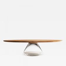 Choose from dark glass or light glass, as well as many shades of wood. Grzegorz Majka Ltd Clear Eclipse Contemporary Coffee Table