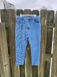 Although you may want to wash a new pair of jeans alone the first time to prevent dye transfer, it's okay to combine dark jeans with like colors (black, gray, and dark blue) on subsequent washes. Hand Painted Geometric Pattern Jeans Vintage Mom Jeans Trendy Women S Clothing Size 14 Custom Pants Artsy Clothes Painted Denim Colorful In 2021 Patterned Jeans Trendy Clothes For Women Womens Clothing Sizes