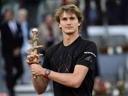 Alexander zverev holds the winner's trophy after his straight sets victory against dominic thiem in the men's final during the mutua madrid open at the caja magica, in madrid, spain, on may 13, 2018. Madrid Masters Alexander Zverev Powers Past Dominic Thiem To Clinch Title Tennis News