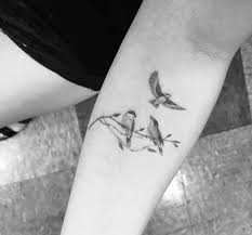Small Birds Flying Away Tattoo Pin By Three Little Birds Design On Actually Maybe A Tattoo White Bird Tattoos Small Bird Tattoos Bird Tattoo Wrist